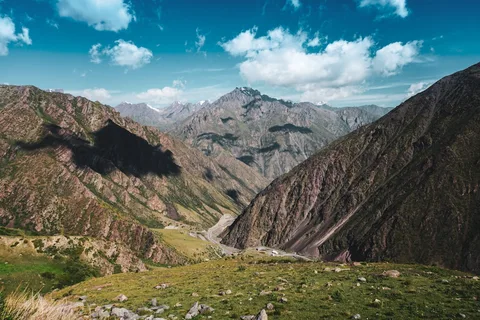 Kyrgyzstan Tour Packages | Safari Sutra Holidays Kyrgyzstan alpine mountains and turquoise lake — adventure tour packages from India | Safari Sutra Holidays