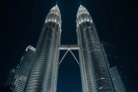 Malaysia Tour Packages for Indian Travellers | Safari Sutra Holidays Petronas Twin Towers Kuala Lumpur Malaysia at golden hour — Malaysia tour packages from India | Safari Sutra